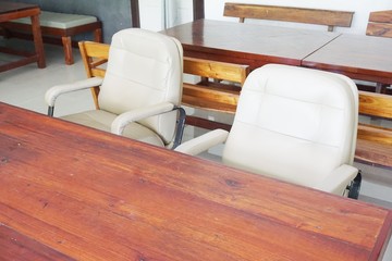 close up chair and wooden table in meeting room