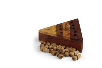 Brain teaser game with pegs on a wooden triangle