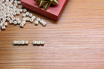 Naklejka premium Father Day celebration on wood background top view