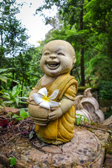 Buddha statue in jungle, Wat Palad, Chiang Mai, Thailand