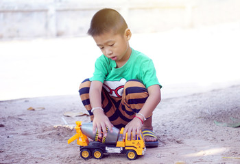Children with playing car toys happily