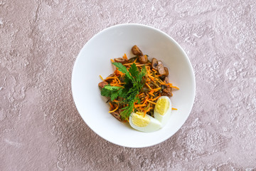 Vegetarian salad with carrot, mushrooms, egg and sea kale