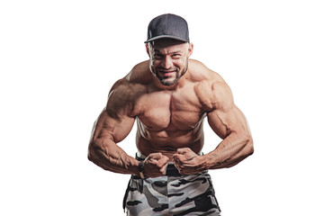 Fototapeta na wymiar Man bodybuilder showing muscular body. Fitness and bodybuilding concept.