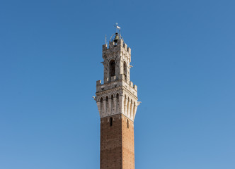 Fototapeta na wymiar Tower of Mangia (Torre del Mangia), in Siena, Italy