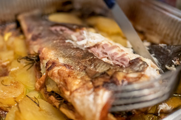 italian  Sparus aurata fish cooked with potatoes