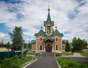 Fototapeta na wymiar Wooden Orthodox Church in the town of Slyudyanka near Lake Baikal
