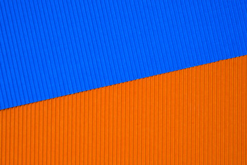 Blue and orange corrugated paper texture, use for background. vivid colour with empty space for add text or object.