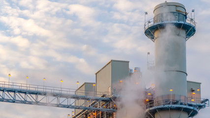 Obraz premium Clear Panorama Steam emitted from a Power Plant in Utah Valley against cloudy blue sky