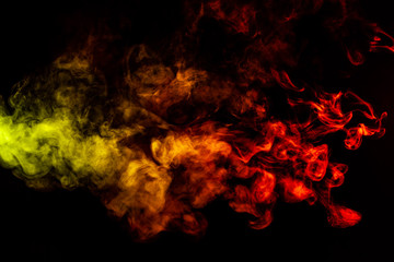 Fototapeta na wymiar Beautiful horizontal column of smoke in the neon bright light of red, green, yellow and orange on a black background exhaled out of the vape. Nice pattern for printing and backdrop of colored waves.