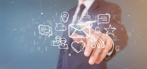 Businessman holding a cloud of social media network icon