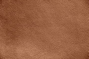 The texture of genuine leather. Impeccable and stylish background.  Beautiful stylish background. Natural skin texture close up. Brown background.  The structure of the leather material brown shades.