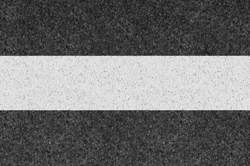 Black asphalt background texture with yellow line