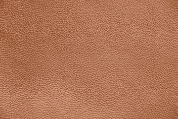 The texture of genuine leather. Impeccable and stylish background.  Beautiful stylish background. Natural skin texture close up. Brown background.  The structure of the leather material brown shades.