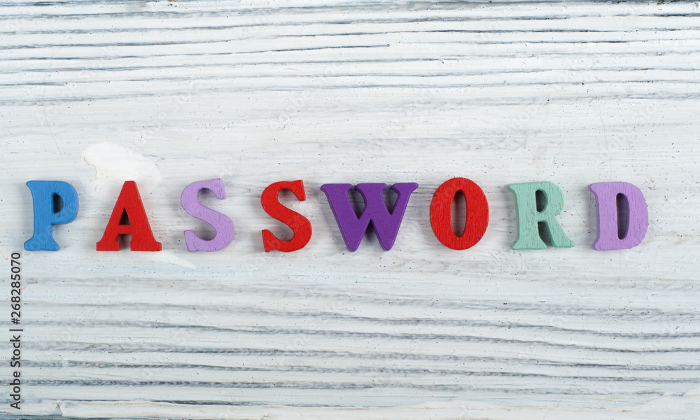 Fototapete password word on wooden background composed from colorful abc alphabet block wooden letters, copy sp