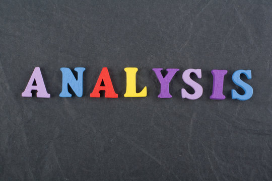 ANALYSIS word on black board background composed from colorful abc alphabet block wooden letters, copy space for ad text. Learning english concept.