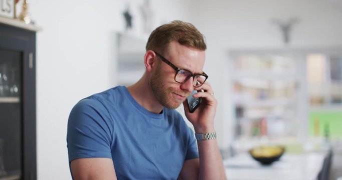 4K Professional man working at home & dealing with a problem over the phone. Slow motion