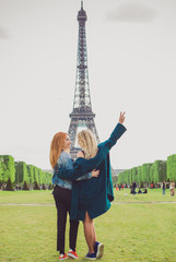 Paris vacation, vintage fashion style . Two Woman at France. Stylish beautiful modern ladies in city