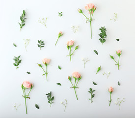 Beautiful flowers with leaves on white background