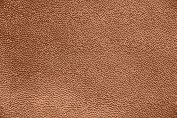 The texture of genuine leather. Impeccable and stylish background.  Beautiful stylish background. Natural skin texture close up. Brown background.  The structure of the leather material brown shades.