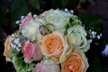 Beautiful wedding bouquet and rings