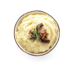 Bowl with tasty mashed potato on white background