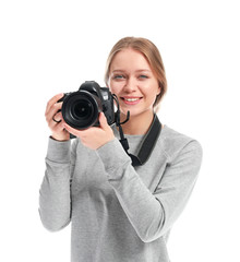 Young female photographer on white background