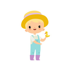 Cute Boy in Overalls, Rubber Boots and Hat Holding Duckling, Young Farmer Cartoon Character Engaged in Agricultural Activities Vector Illustration