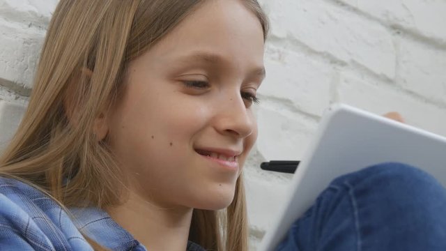 Child Studying on Tablet, Girl Writing for School Class, Learning Doing Homework