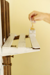 Person renovating wooden hanger