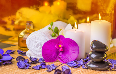 candles and flowers on bamboo mat