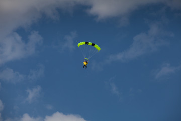 Skydive, people in the sky, under clouds