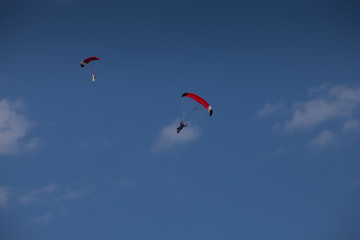Skydive, people in the sky, under clouds