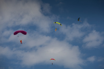 Skydive, people in the sky, under clouds