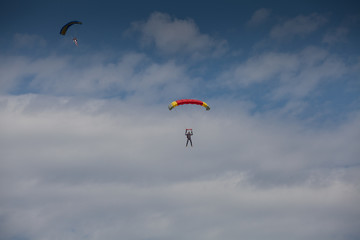Skydive, people in the sky, under clouds