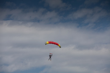 Skydive, people in the sky, under clouds