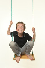 child playing with a swing on a white background