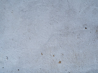 The old gray plaster is covered with cracks, scratches.