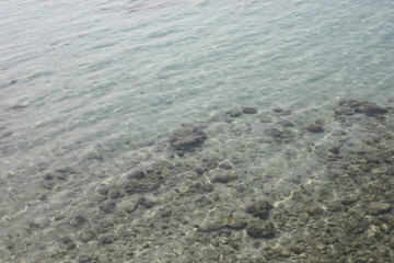 Scenic view of stones from transparent water of the sea.