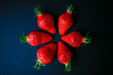 Group of delicious strawberrys on black background