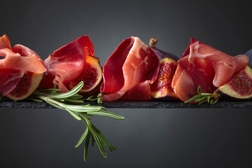 Figs with prosciutto and rosemary.