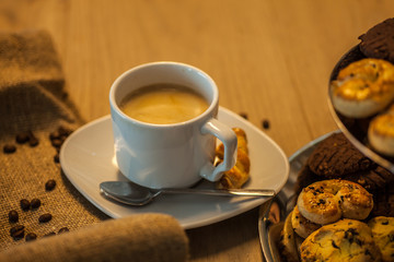 Coffee cup coffee beans and cakes