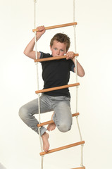 child on a rope ladder