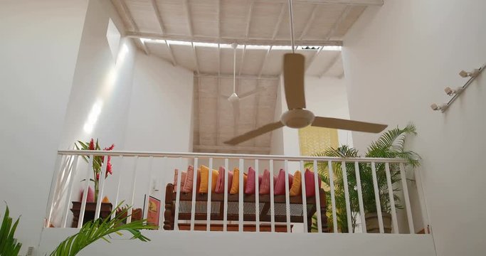 Modern ceiling fan in the living room. tracking shot. in slow motion. Shot on Canon 1DX mark2 4K camera