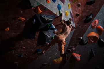 Athletic man practicing in a bouldering gym © Nejron Photo