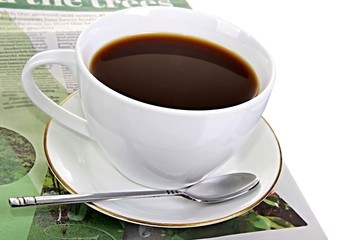 newspaper piled up on a table in a office with cup of black coffee and white background no people stock photo