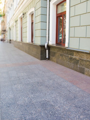 textured street wall. Facade of the house of a city street Background for model shooting