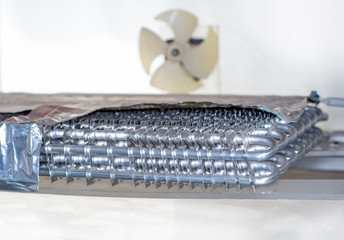 Used Coil or evaporator part of central air conditioner on white background.