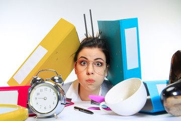 A million tasks. Young woman getting a lot of work and deadline, being under the pressure of the...