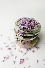 healthy smoothie breakfast in a glass jar with lilac flowers