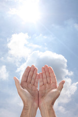 open man's hands rising to the sky in a pray gesture with copy space for your text